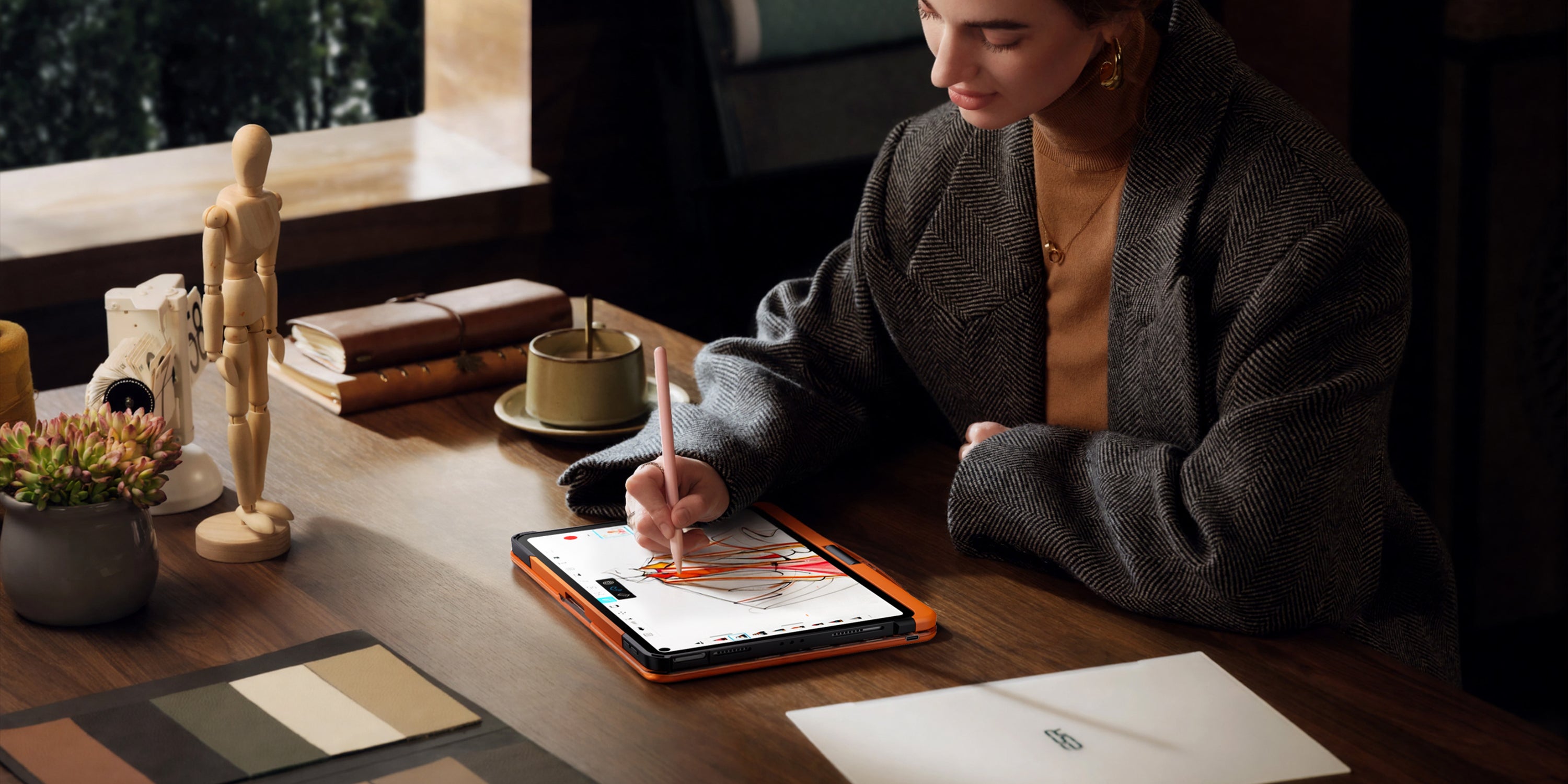 Orange transparent iPad keyboard case used for creative work and note taking