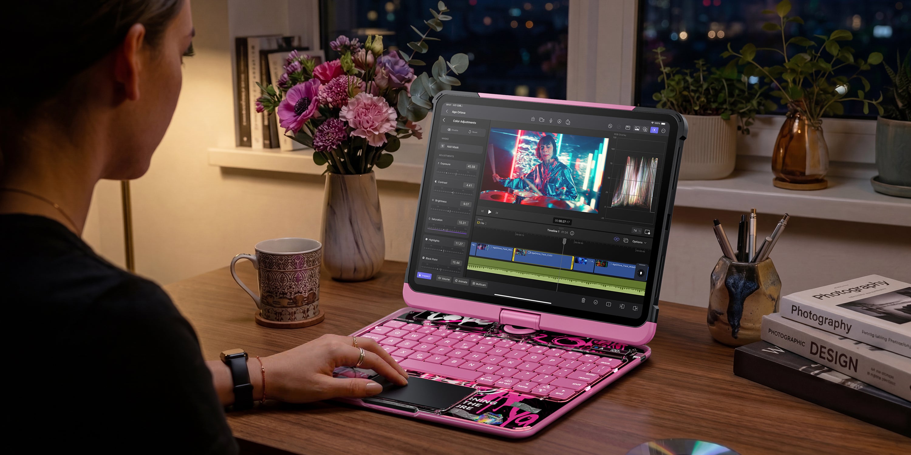 Pink transparent iPad keyboard case used in a creative desk setup